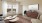 a living room with a painting and a table