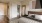 a bedroom with a bed and a mirror