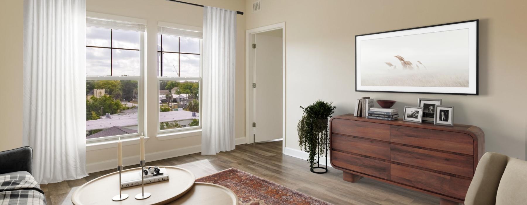 a living room with a painting and a table