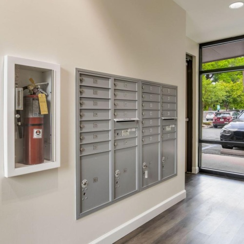 Everything within reach a spacious room with windows and mail receptacles