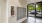 a spacious room with windows and mail receptacles