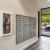 a spacious room with windows and mail receptacles
