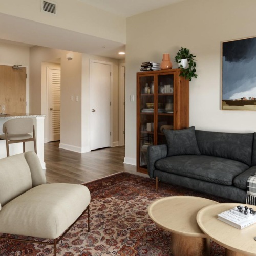 Settle into comfort at Savoy Place a living room with a couch and a table