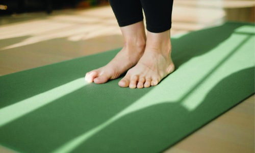 Get your workout on feet on a yoga mat