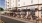 people sitting at tables outside a building
