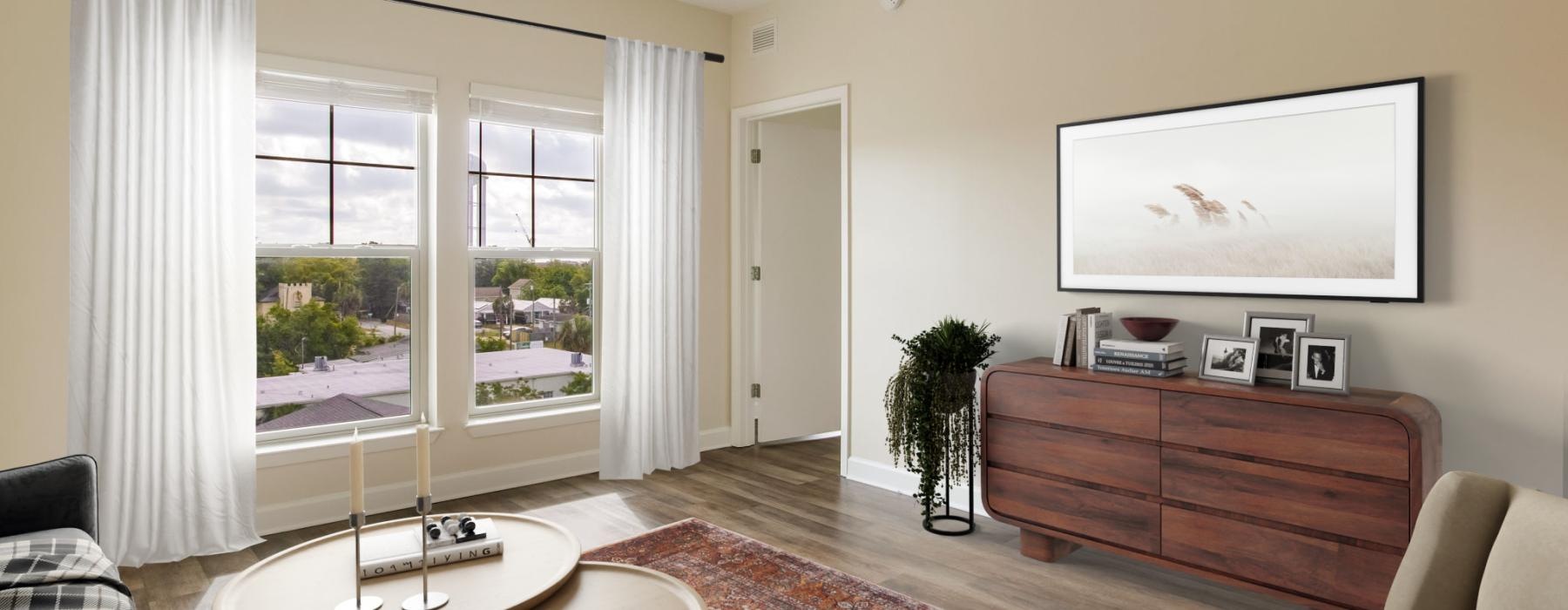 a living room with a painting and a table